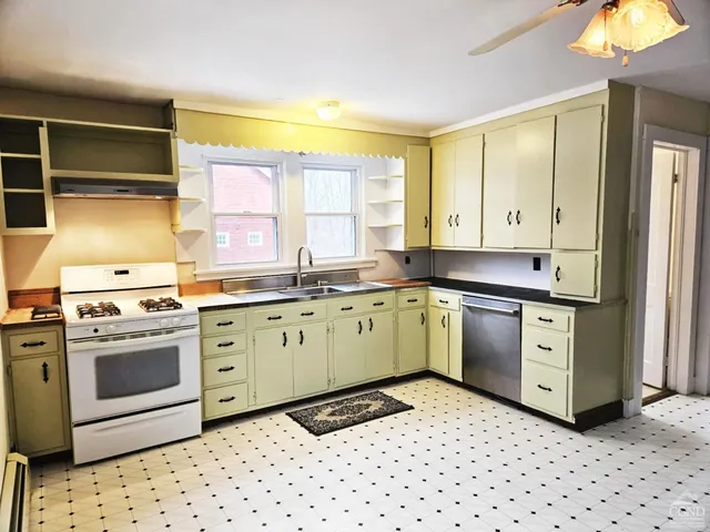 a view of a backyard with large trees