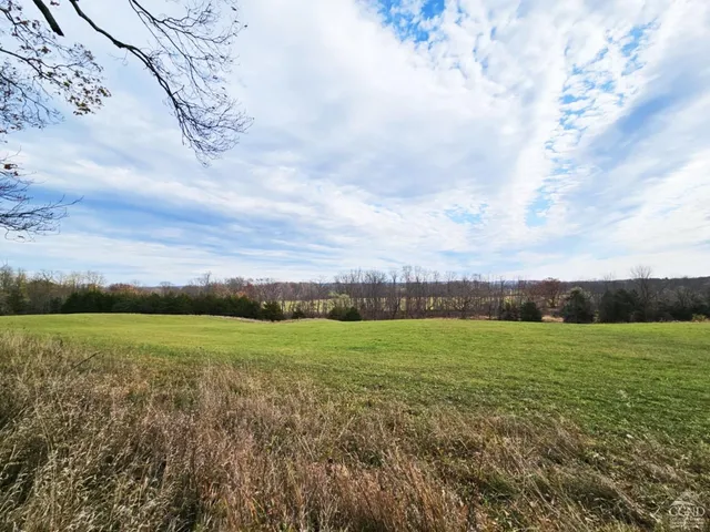 a kitchen with stainless steel appliances granite countertop a refrigerator stove top oven and sink