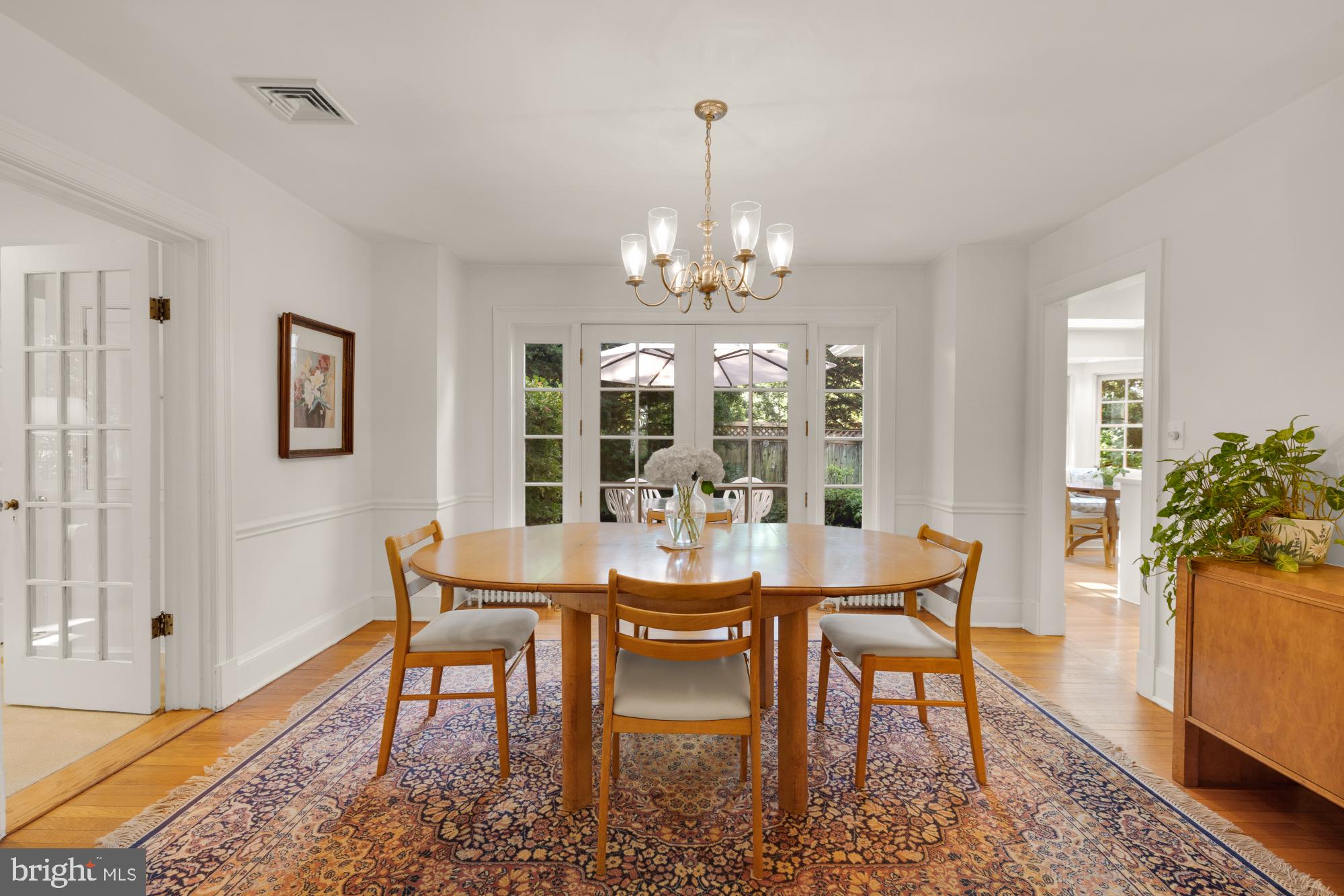 3514 Shepherd Street Chevy Chase, MD 20815 - Photo 13 of 42 a view of a dining room with furniture and wooden floor