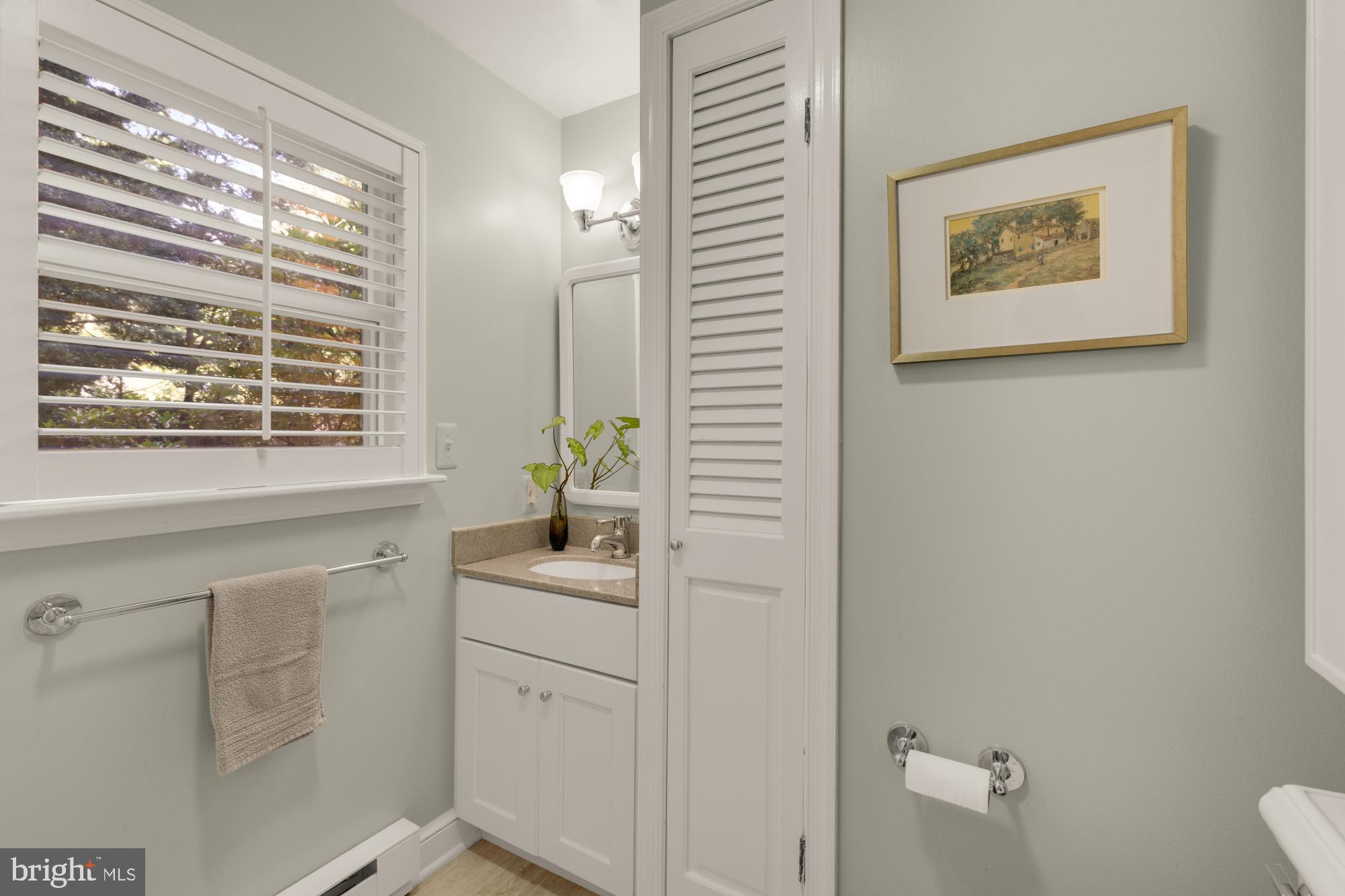 3514 Shepherd Street Chevy Chase, MD 20815 - Photo 17 of 42 a bathroom with a sink a toilet and a window