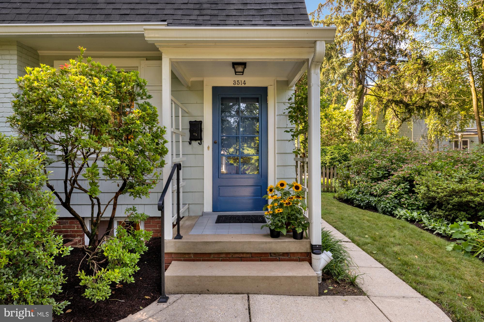 3514 Shepherd Street Chevy Chase, MD 20815 - Photo 2 of 42 a front view of a house with a garden