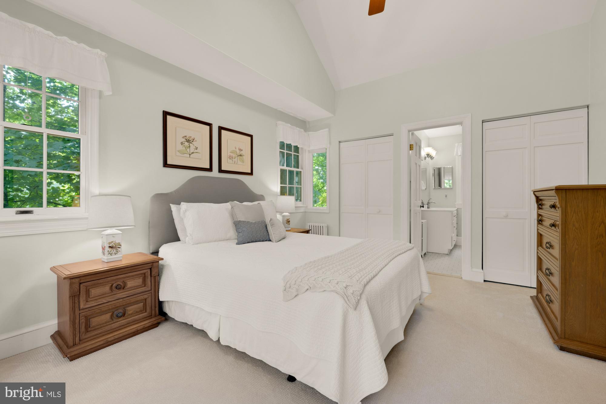 3514 Shepherd Street Chevy Chase, MD 20815 - Photo 21 of 42 a spacious bedroom with a bed a couch and a window