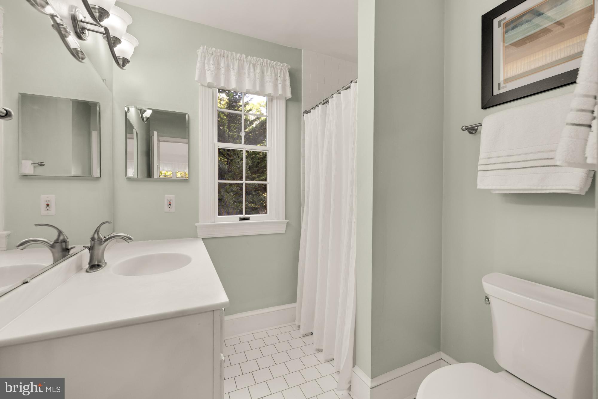 3514 Shepherd Street Chevy Chase, MD 20815 - Photo 22 of 42 a bathroom with a sink toilet and shower