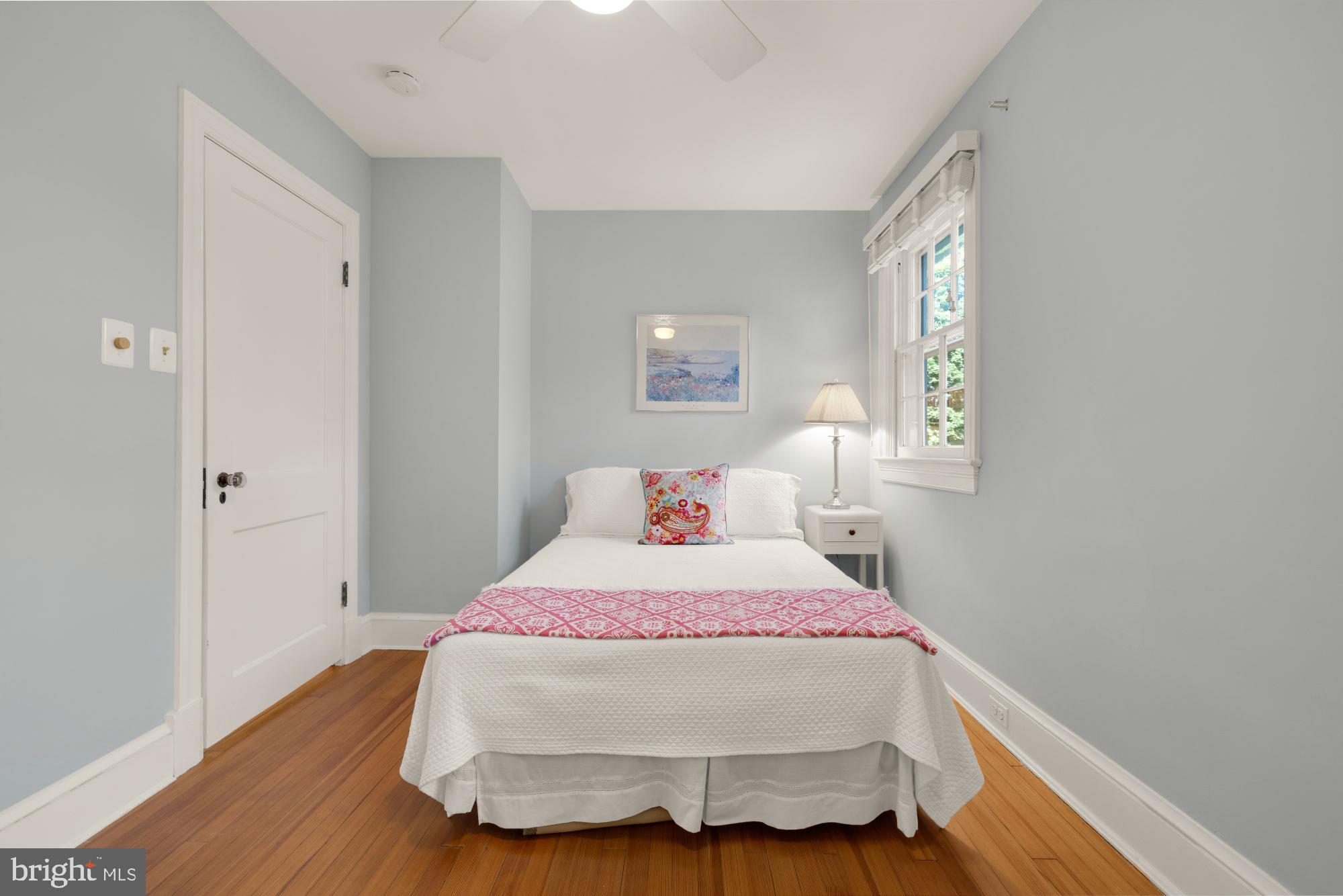 3514 Shepherd Street Chevy Chase, MD 20815 - Photo 24 of 42 a bed sitting in a bedroom next to a window