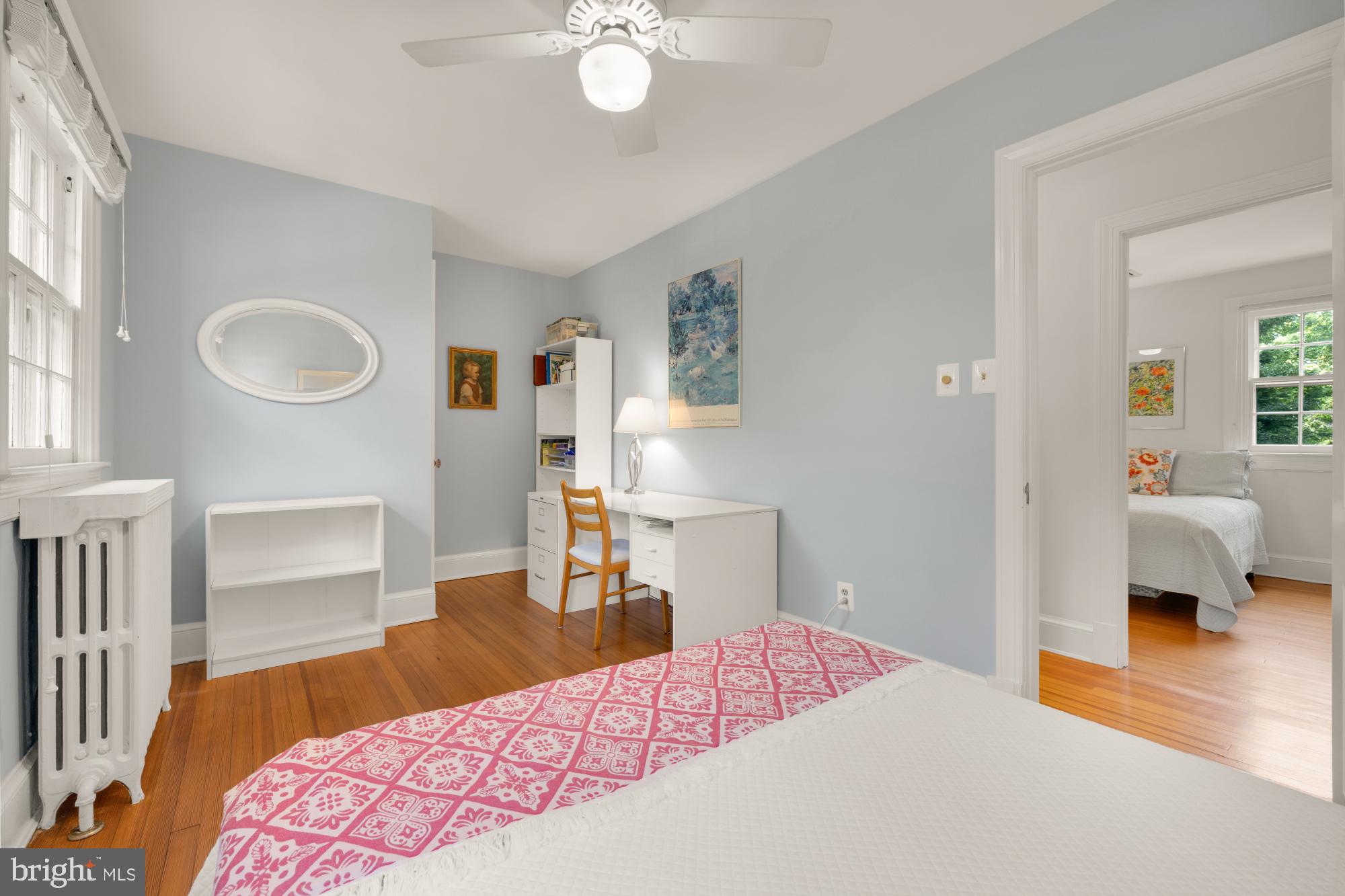 3514 Shepherd Street Chevy Chase, MD 20815 - Photo 26 of 42 a bedroom with a bed and wooden floor