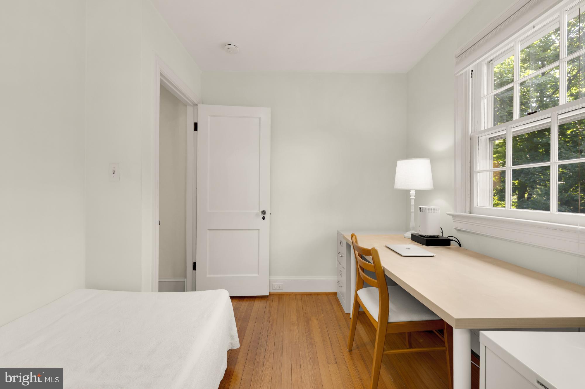 3514 Shepherd Street Chevy Chase, MD 20815 - Photo 30 of 42 a bedroom with a bed and a window