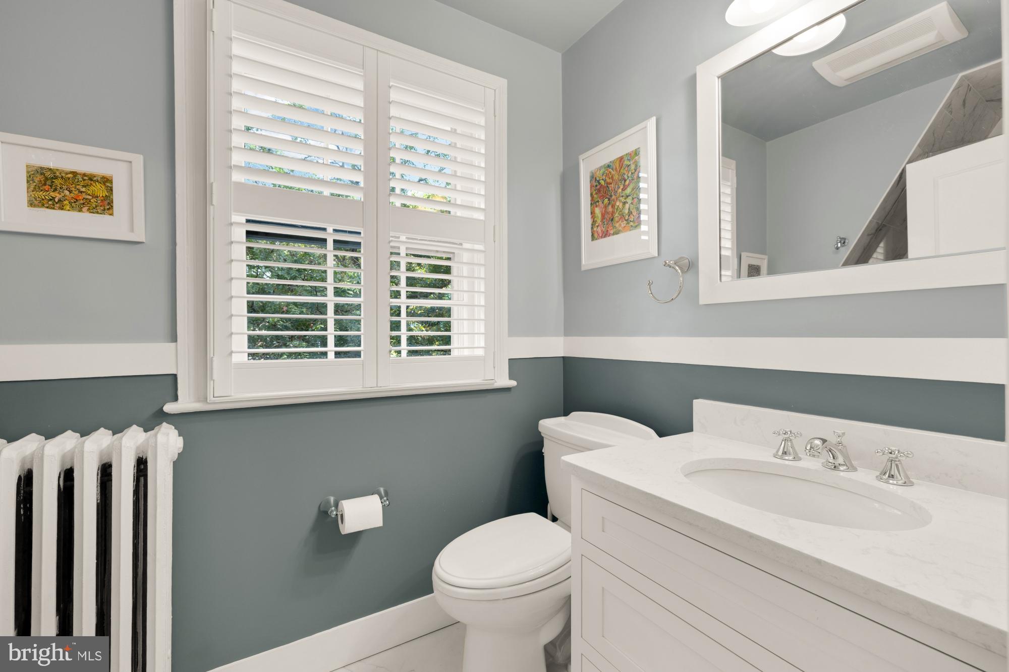 3514 Shepherd Street Chevy Chase, MD 20815 - Photo 32 of 42 a bathroom with a toilet a sink and a window