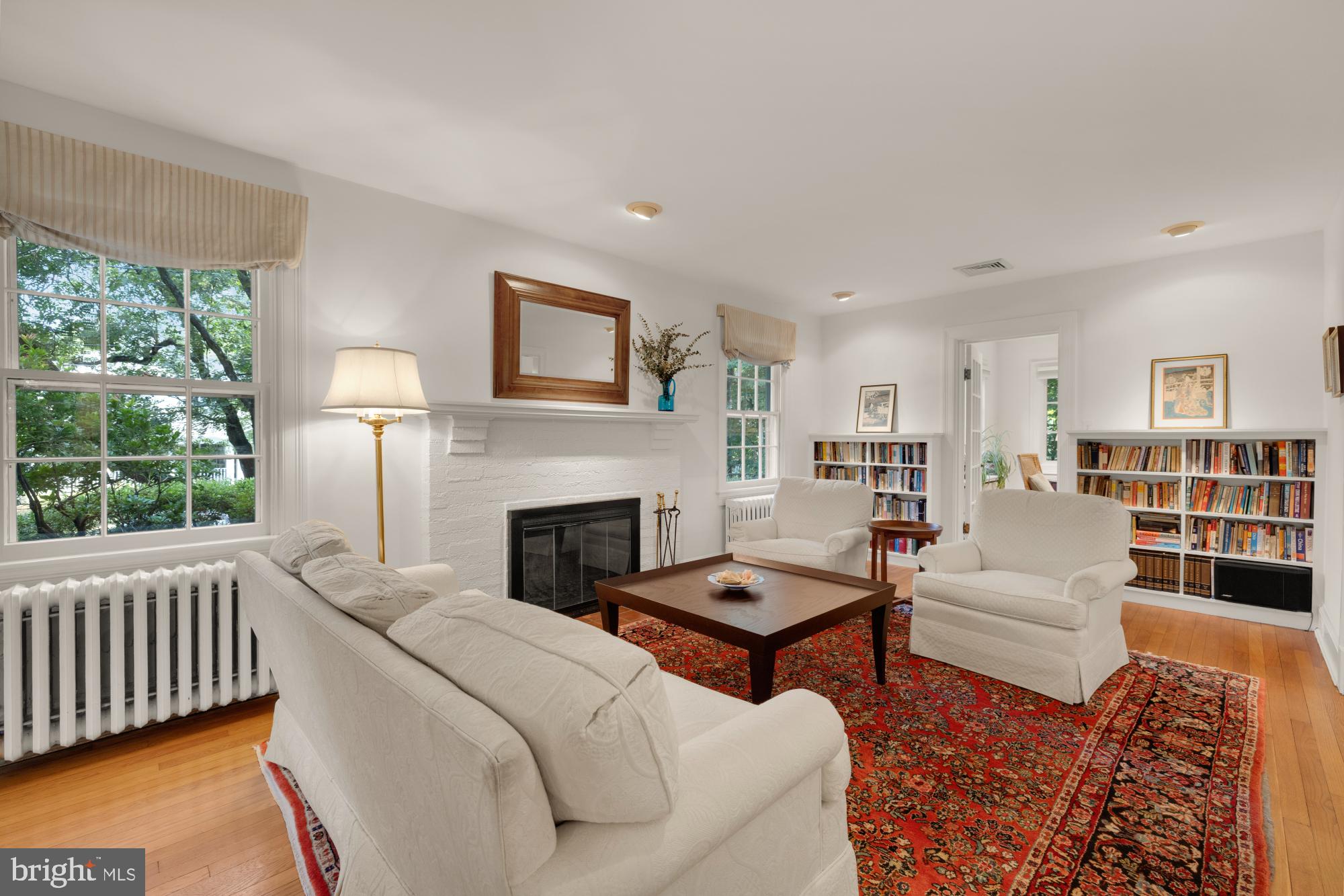 3514 Shepherd Street Chevy Chase, MD 20815 - Photo 6 of 42 a living room with furniture and a fireplace