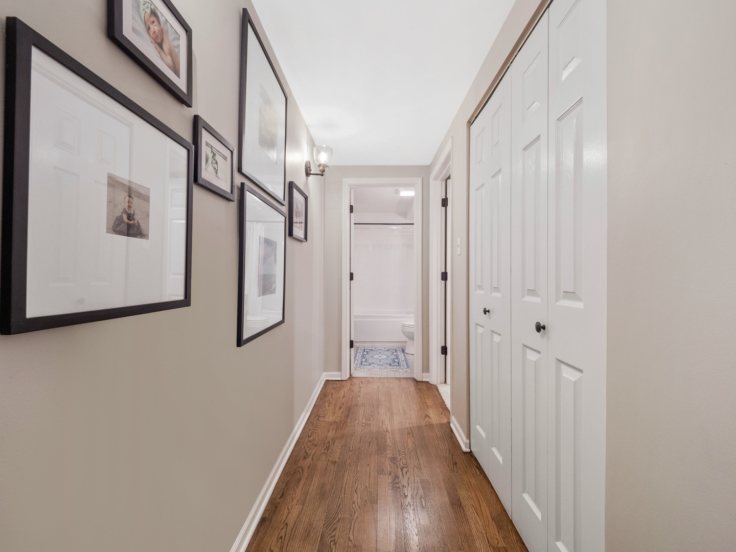 2439 North Burling Street, Unit G Chicago, IL 60614 - Photo 12 of 20 a view of a hallway with wooden floor and staircase
