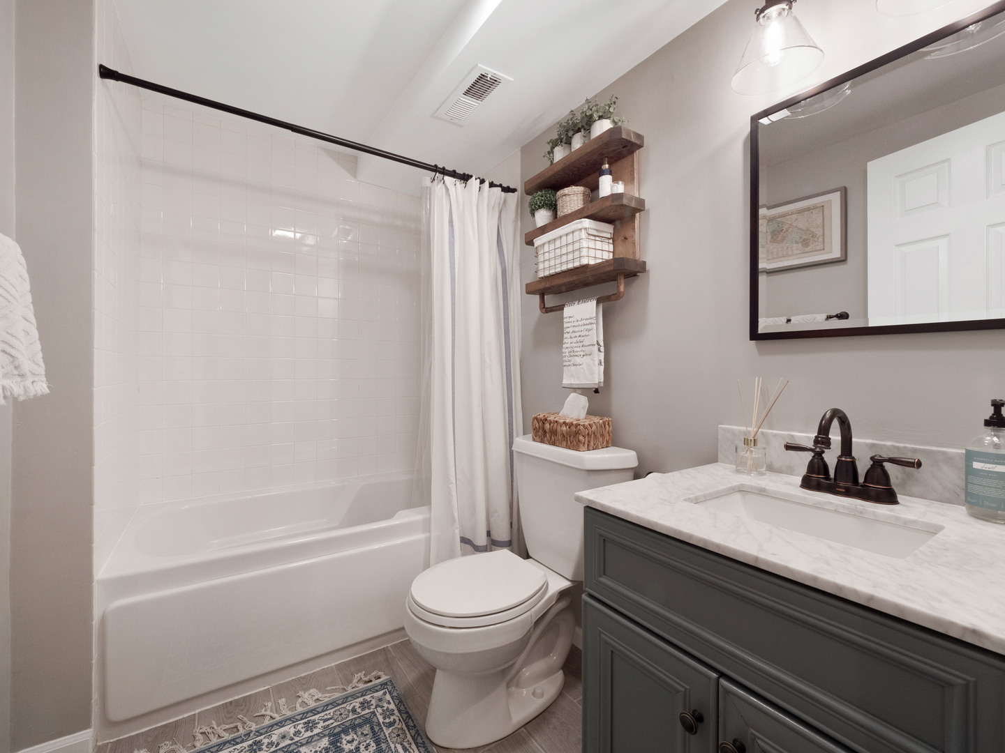 2439 North Burling Street, Unit G Chicago, IL 60614 - Photo 14 of 20 a bathroom with a sink a toilet and shower