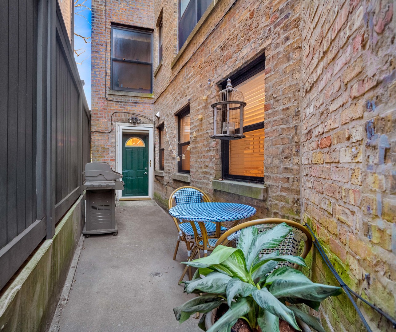 2439 North Burling Street, Unit G Chicago, IL 60614 - Photo 19 of 20 a view of a porch with furniture and a yard