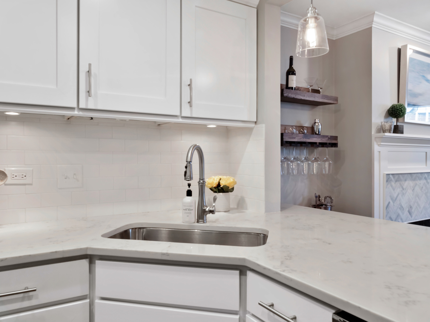 2439 North Burling Street, Unit G Chicago, IL 60614 - Photo 5 of 20 a kitchen with stainless steel appliances granite countertop white cabinets and a sink