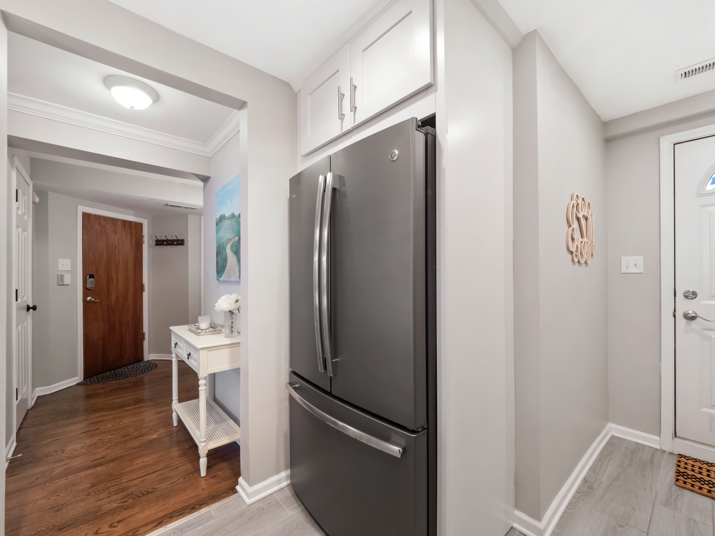 2439 North Burling Street, Unit G Chicago, IL 60614 - Photo 7 of 20 a kitchen with stainless steel appliances a refrigerator and a sink