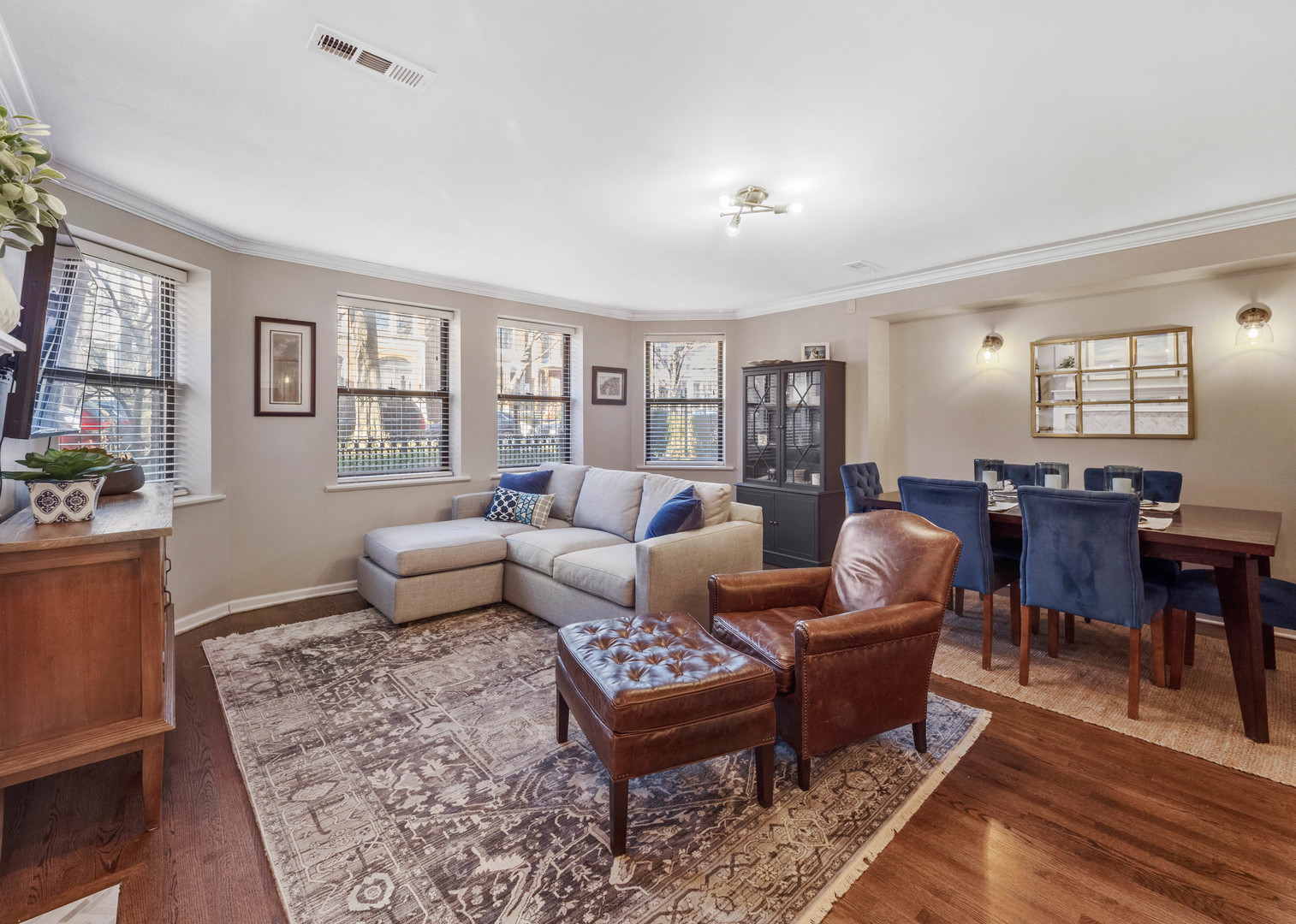 2439 North Burling Street, Unit G Chicago, IL 60614 - Photo 9 of 20 a living room with furniture potted plant and windows