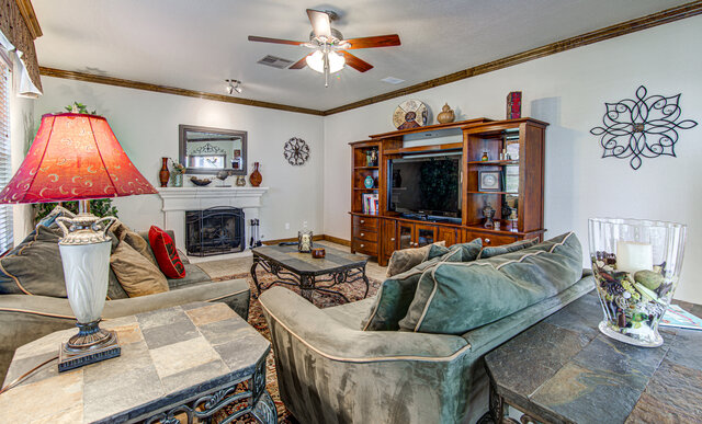 7712 Earp Way Austin, TX 78729 - Photo 13 of 37 a living room with furniture and a flat screen tv