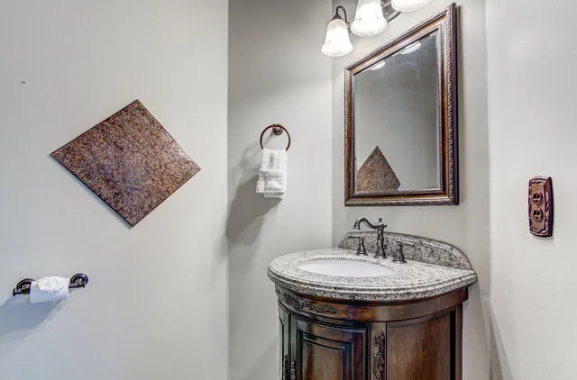 a bathroom with a sink and a mirror