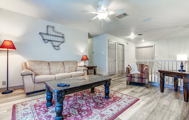 7712 Earp Way Austin, TX 78729 - Photo 24 of 37 a living room with furniture and a rug