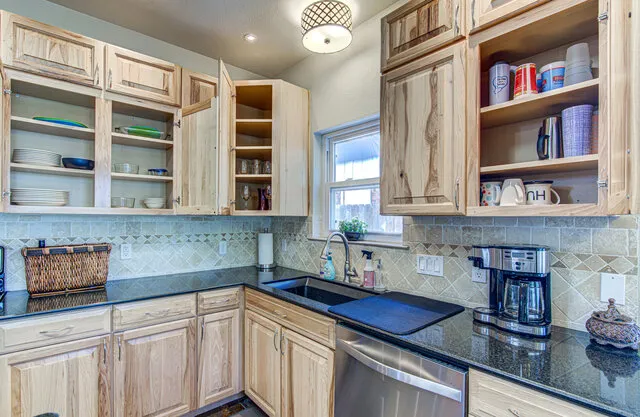 a kitchen with stainless steel appliances a cabinets and a counter top space