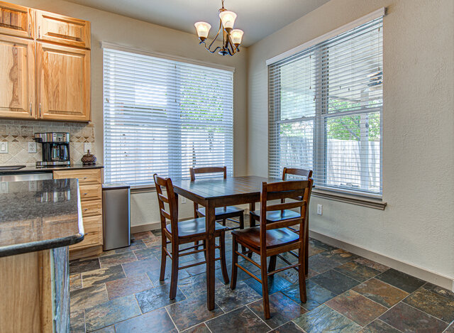 7712 Earp Way Austin, TX 78729 - Photo 10 of 37 a dining room with furniture and window