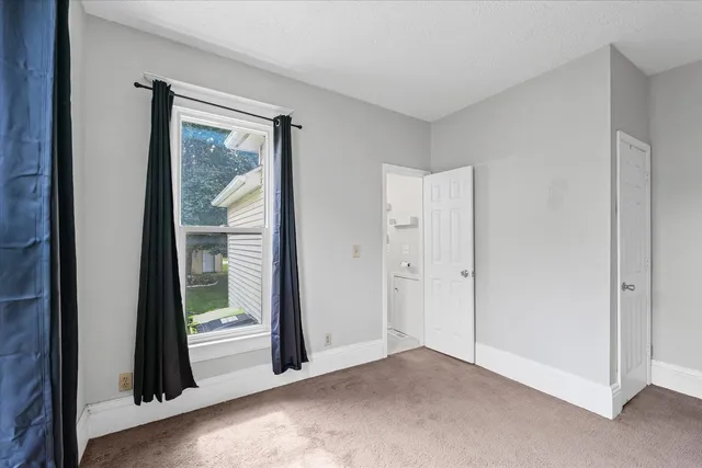 a view of a room with a large window