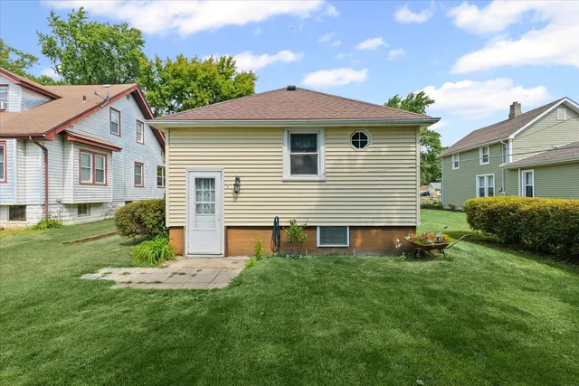 a picture of a bathroom with a white wall and a picture