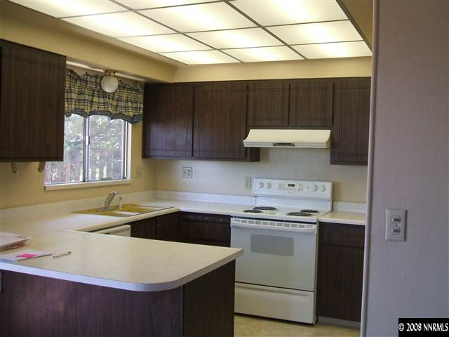 400 Talus Way Reno, NV 89503 - Photo 3 of 8 a kitchen with a sink a stove and cabinets