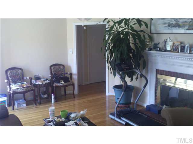3317 Old Buffalo Road Raleigh, NC 27604 - Photo 2 of 7 a living room with furniture and a potted plant