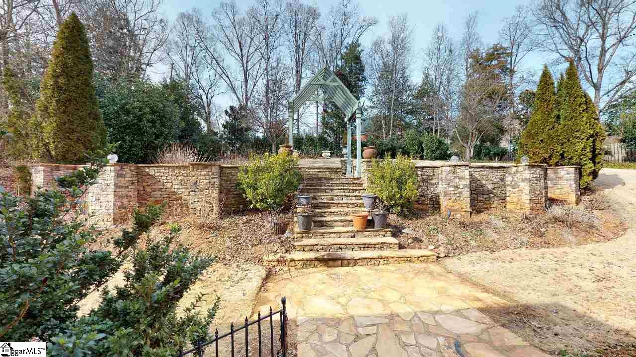 5 Deer Track Road Simpsonville, SC 29681 - Photo 30 of 35 View of the stone retaining wall and steps leading to the upper patio.