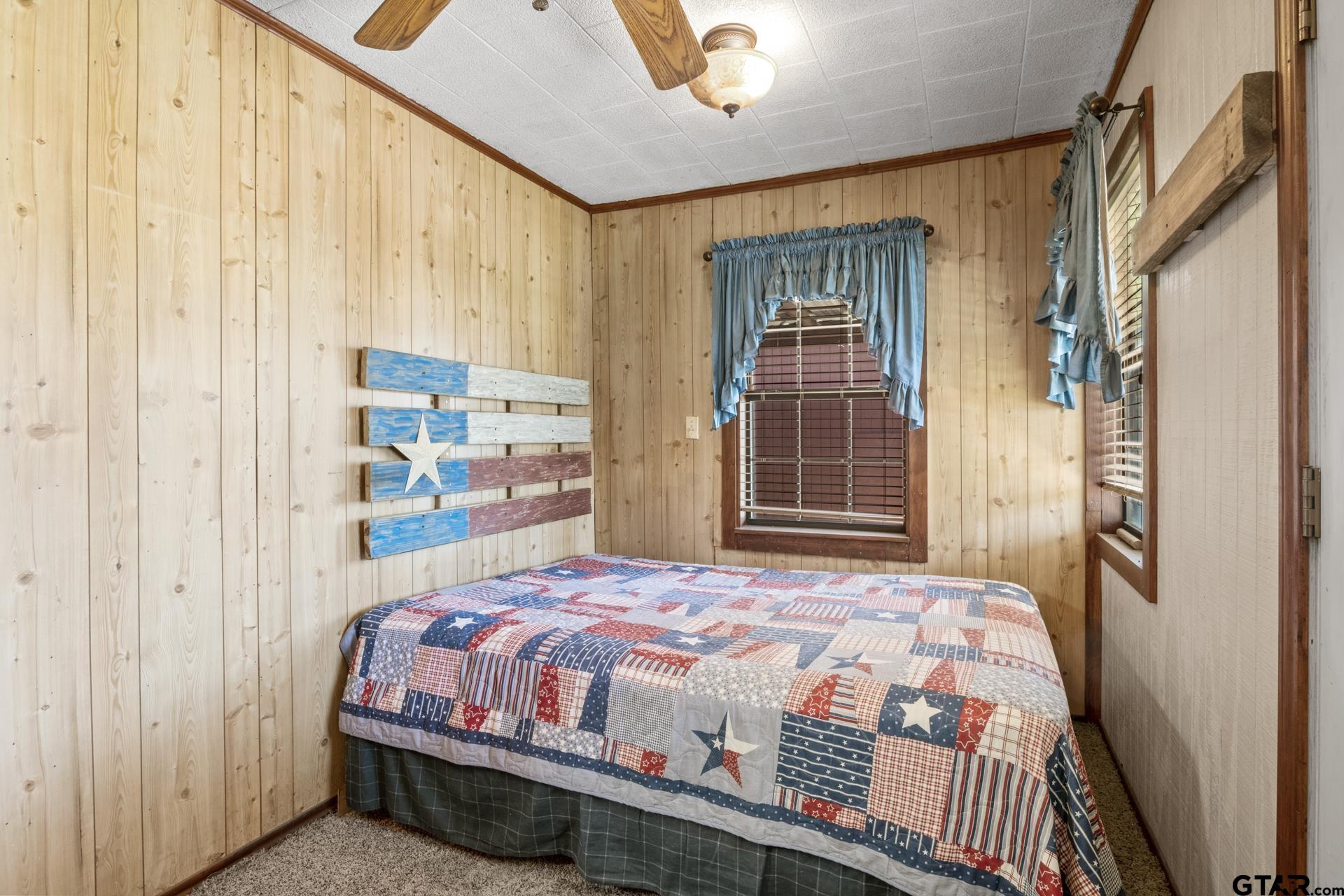 71 Private Road Pittsburg, TX 75686 - Photo 17 of 39 a bedroom with a bed and a window