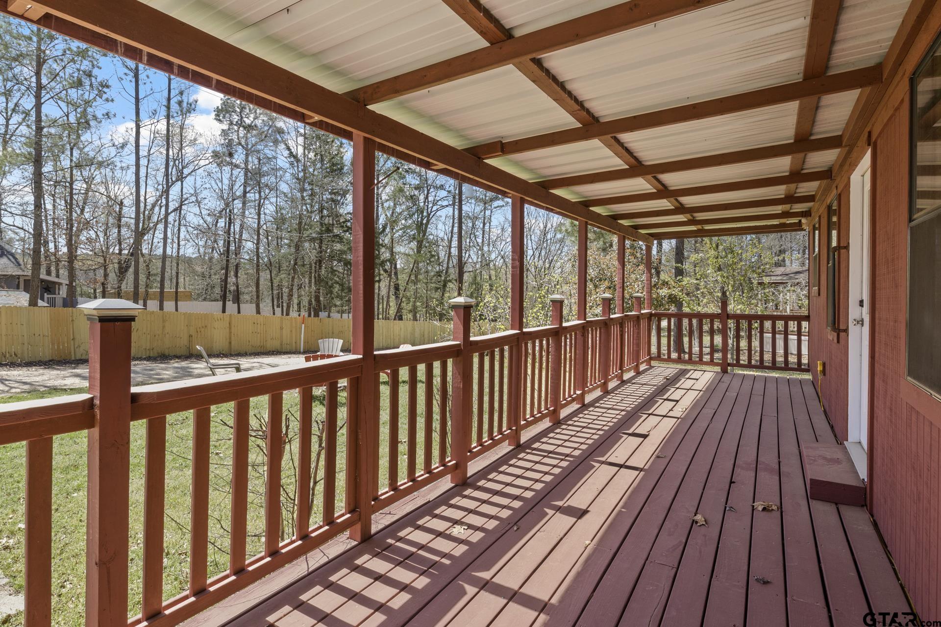 71 Private Road Pittsburg, TX 75686 - Photo 18 of 39 a view of balcony with wooden floor