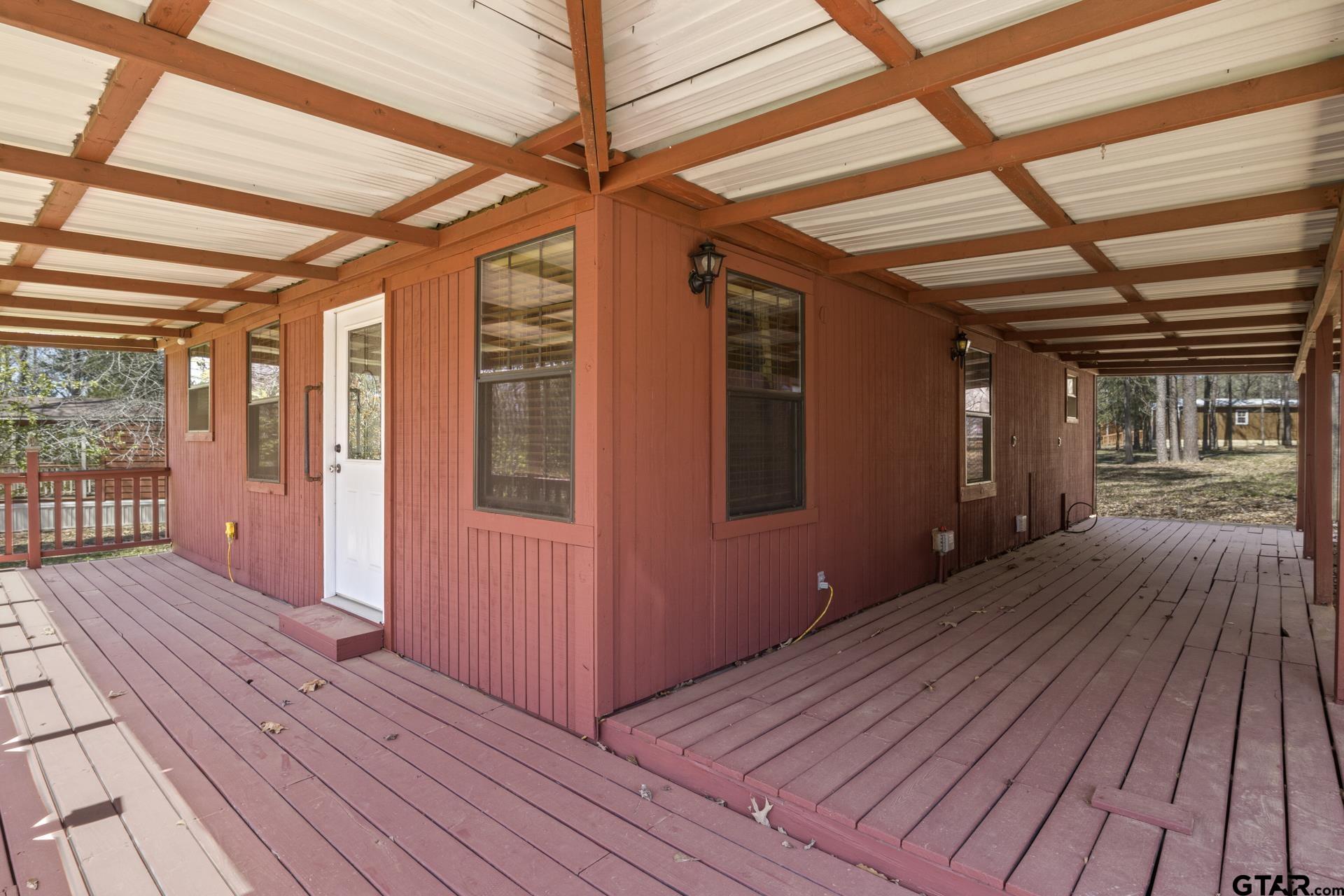 71 Private Road Pittsburg, TX 75686 - Photo 19 of 39 a view of wooden deck