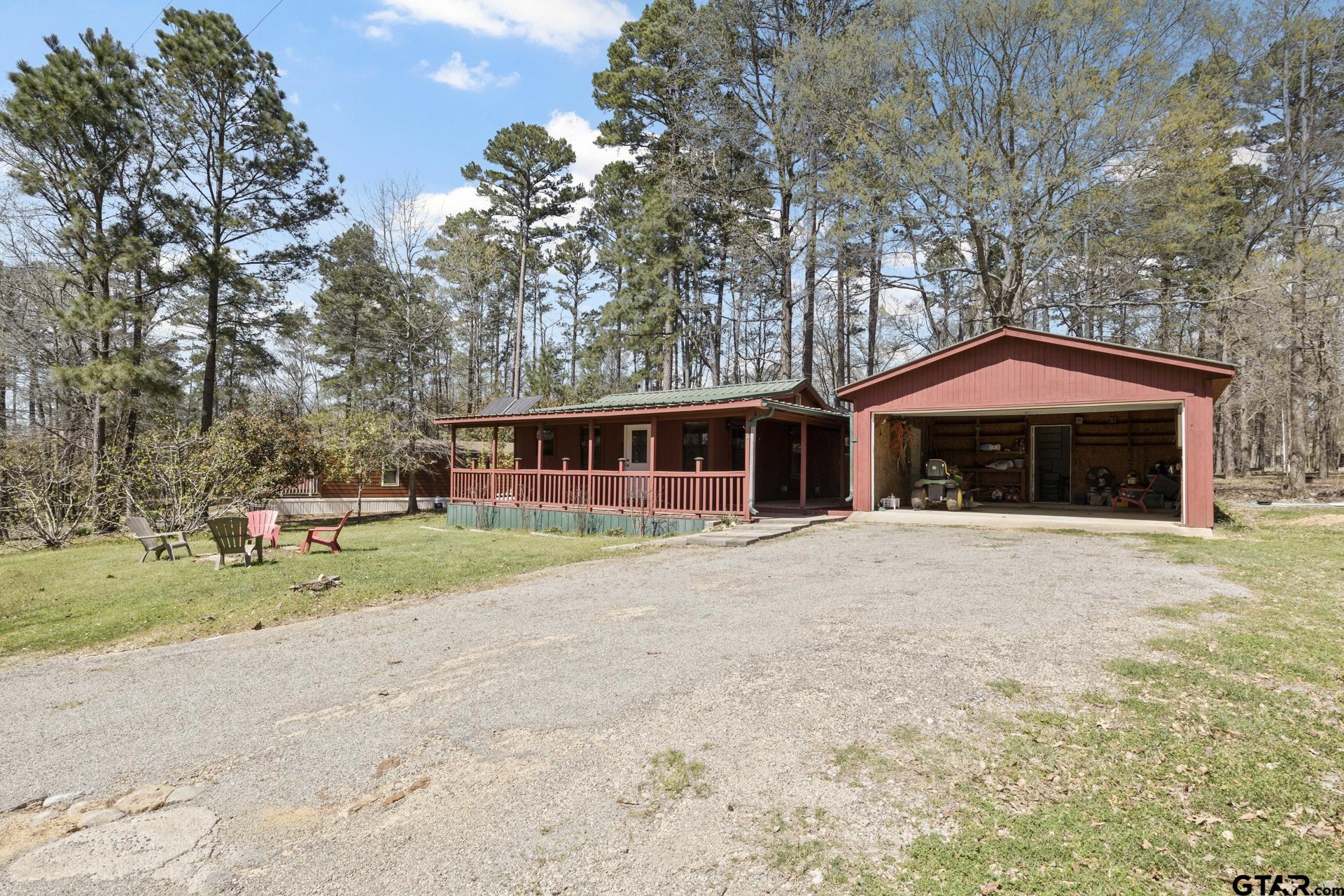 71 Private Road Pittsburg, TX 75686 - Photo 21 of 39 a front view of a house with garden