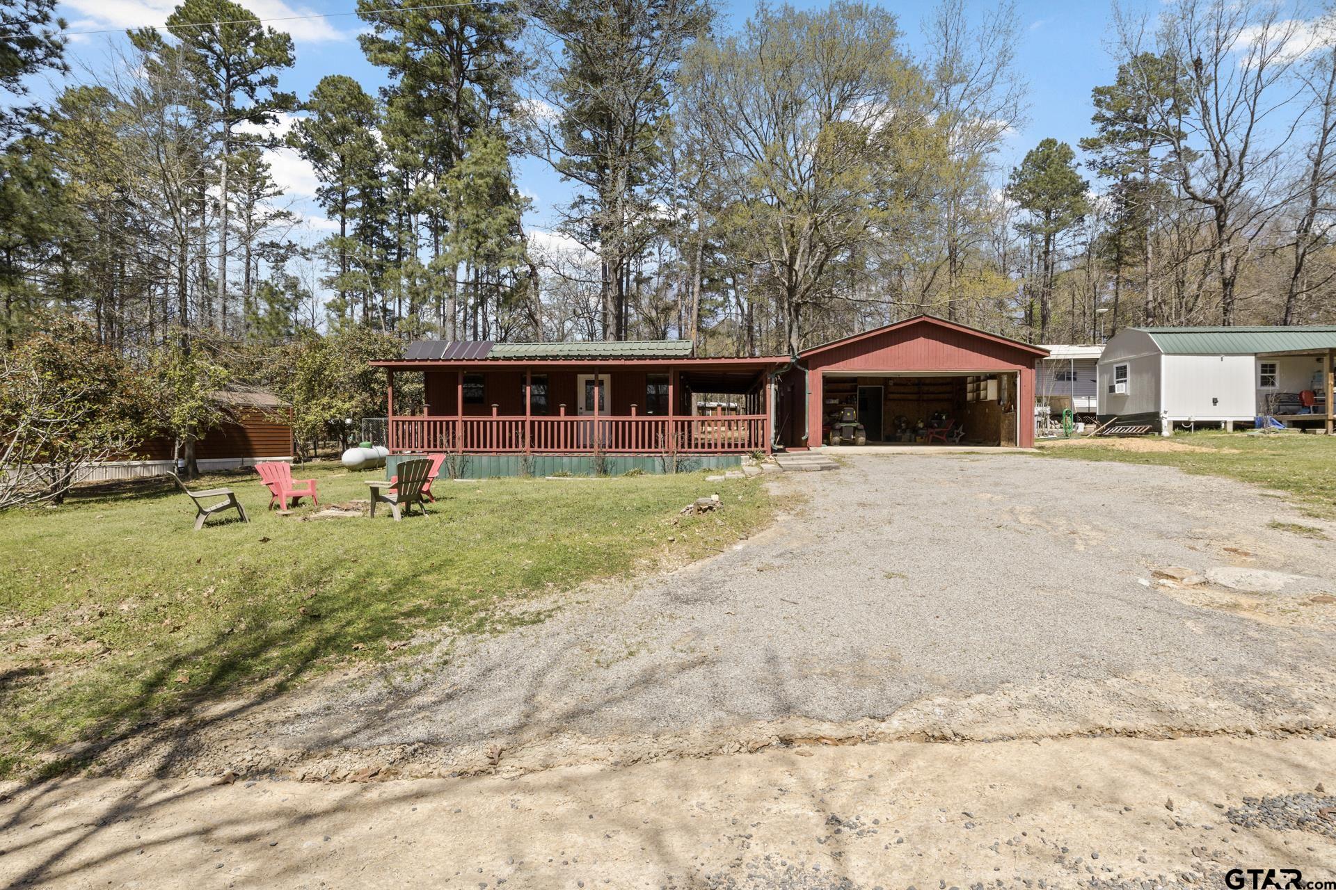 71 Private Road Pittsburg, TX 75686 - Photo 22 of 39 a view of a house with a yard