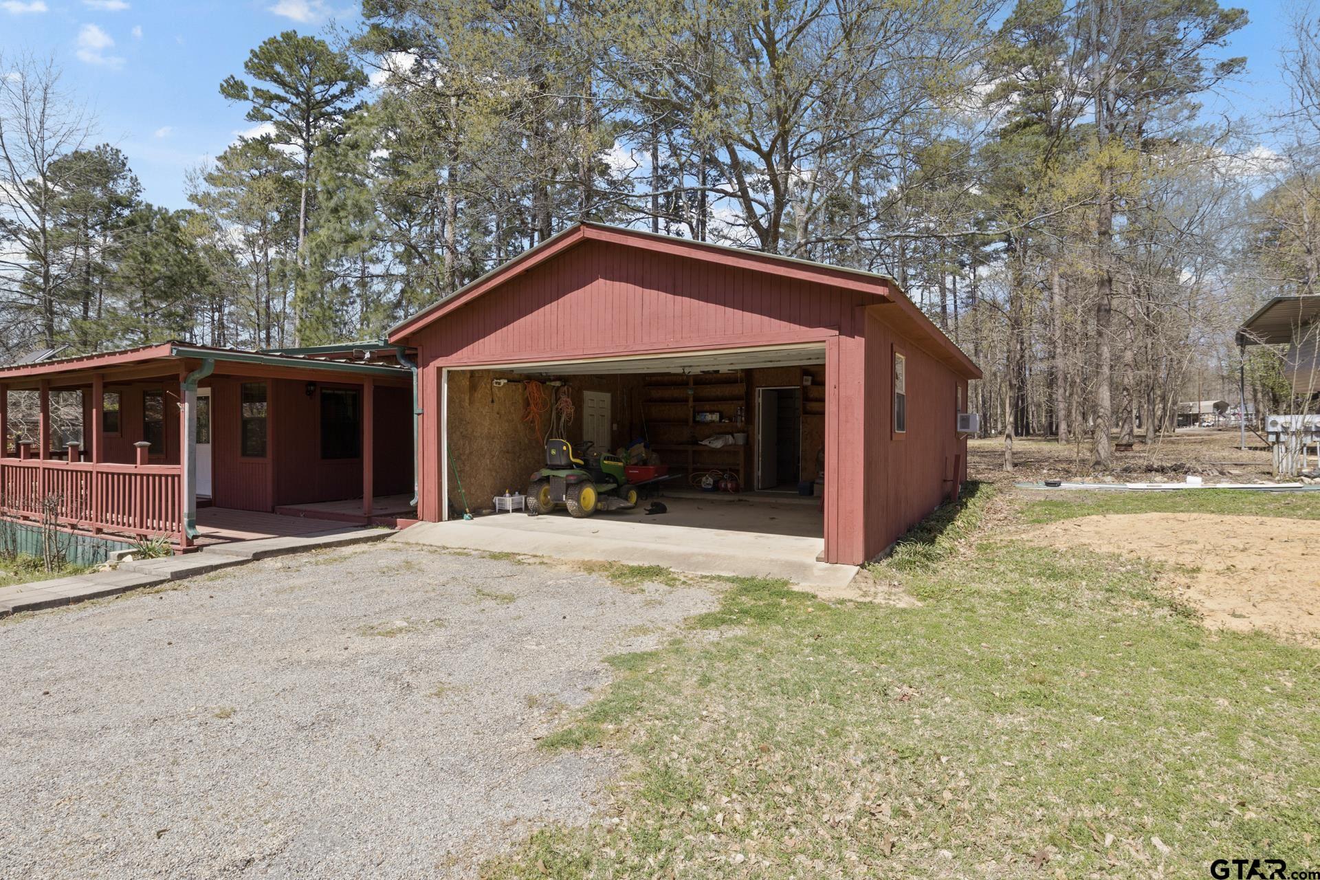 71 Private Road Pittsburg, TX 75686 - Photo 25 of 39 a view of a house with a yard and large tree