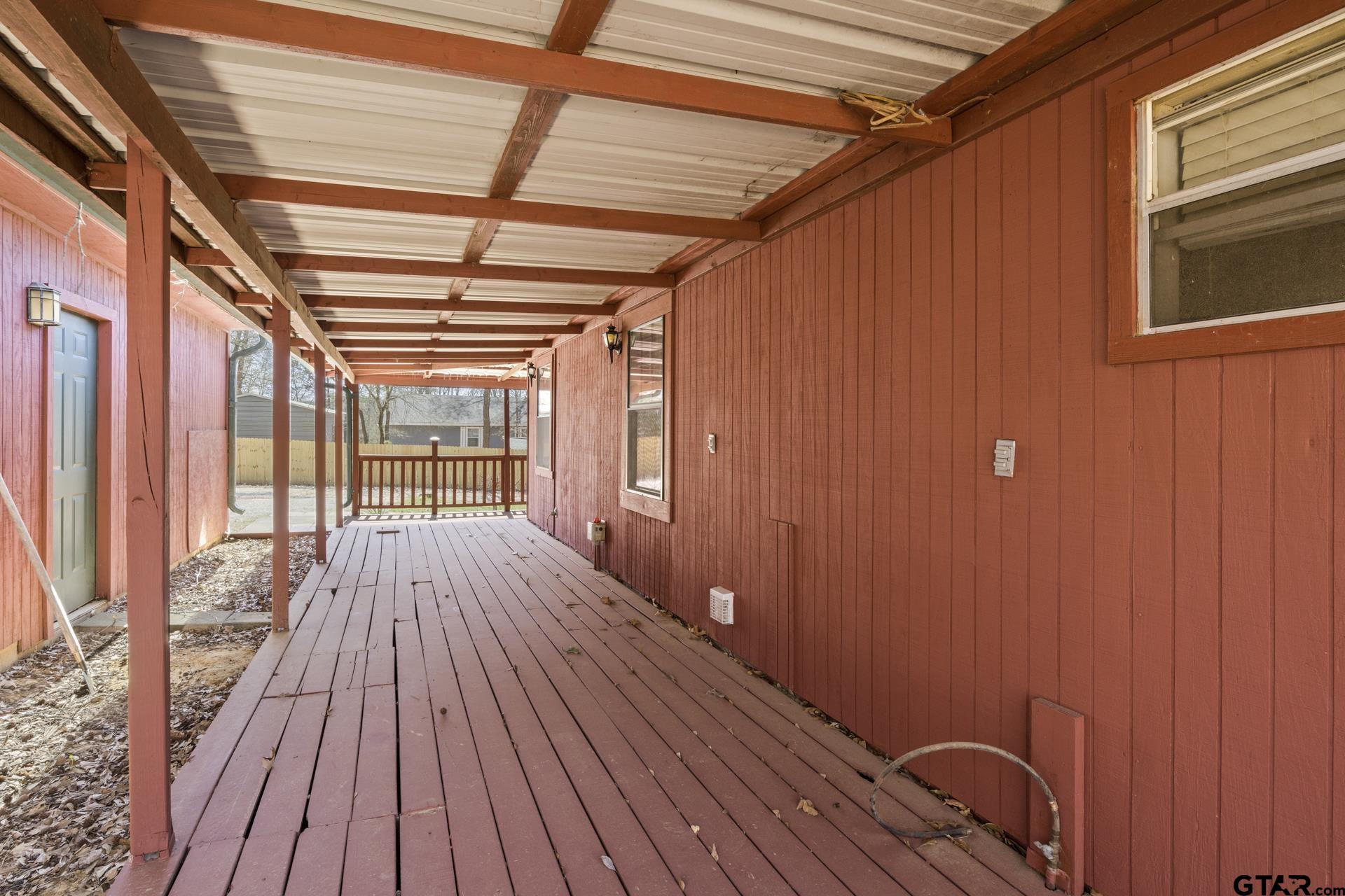 71 Private Road Pittsburg, TX 75686 - Photo 26 of 39 a view of empty room with wooden floor