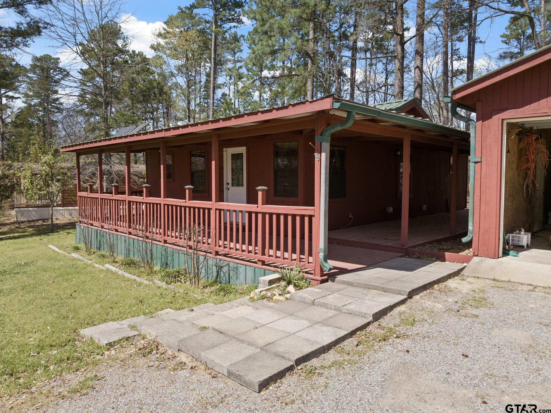 71 Private Road Pittsburg, TX 75686 - Photo 3 of 39 a view of a house with a yard and deck