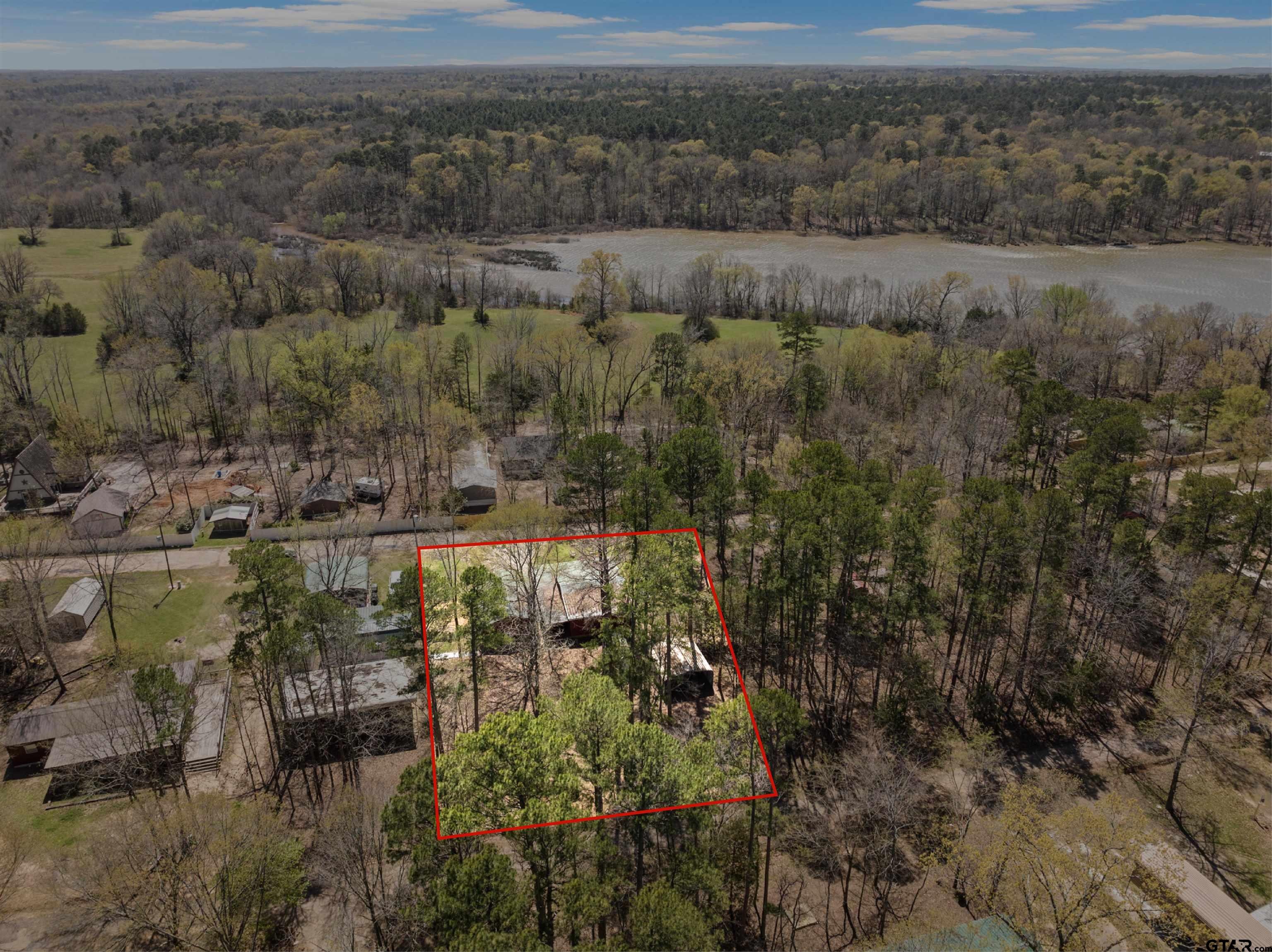 71 Private Road Pittsburg, TX 75686 - Photo 36 of 39 a view of a lake with mountains in the background