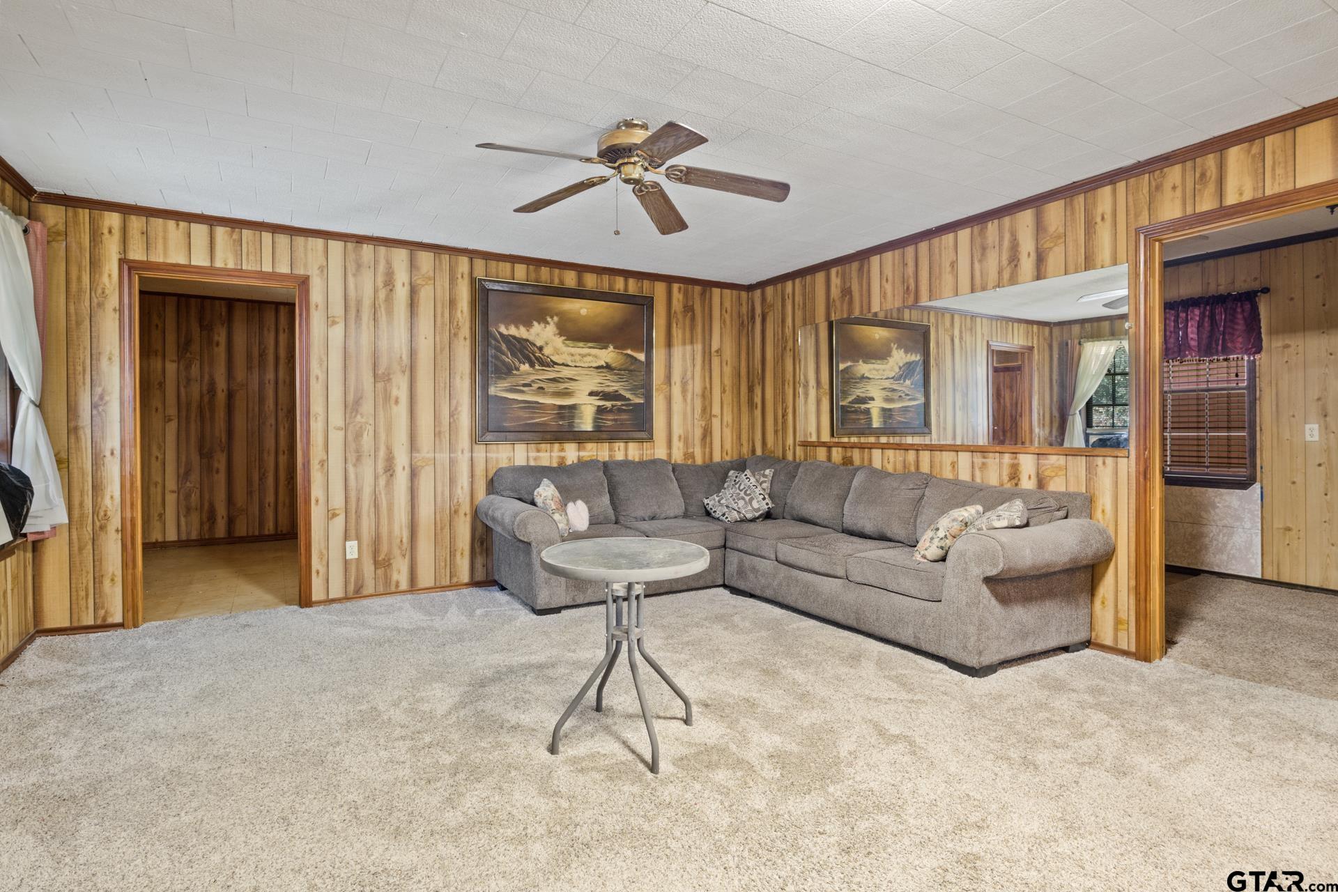 71 Private Road Pittsburg, TX 75686 - Photo 5 of 39 a living room with furniture and a large window