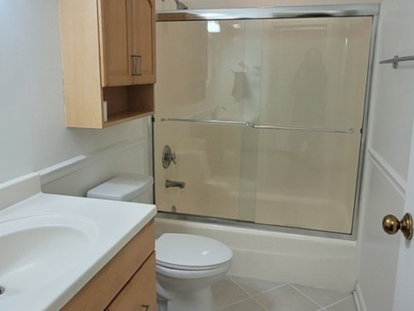 760 Weidner Road, Unit 107 Buffalo Grove, IL 60089 - Photo 12 of 22 a bathroom with a granite countertop sink toilet and shower