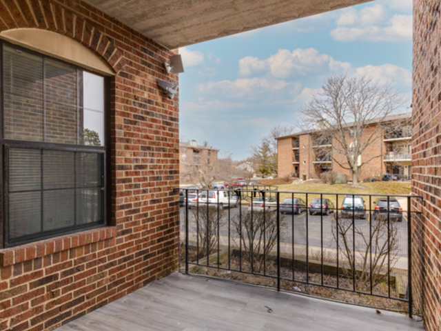 760 Weidner Road, Unit 107 Buffalo Grove, IL 60089 - Photo 15 of 22 a view of a brick building from a door