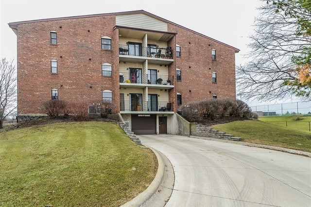 760 Weidner Road, Unit 107 Buffalo Grove, IL 60089 - Photo 22 of 22 a swimming pool with outdoor seating and yard