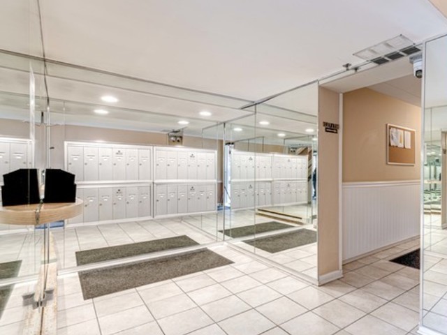 760 Weidner Road, Unit 107 Buffalo Grove, IL 60089 - Photo 3 of 22 a bathroom with a glass shower door and a glass door