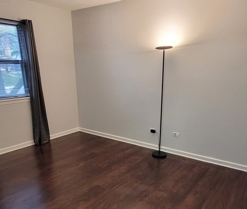 760 Weidner Road, Unit 107 Buffalo Grove, IL 60089 - Photo 9 of 22 a view of a room with wooden floor