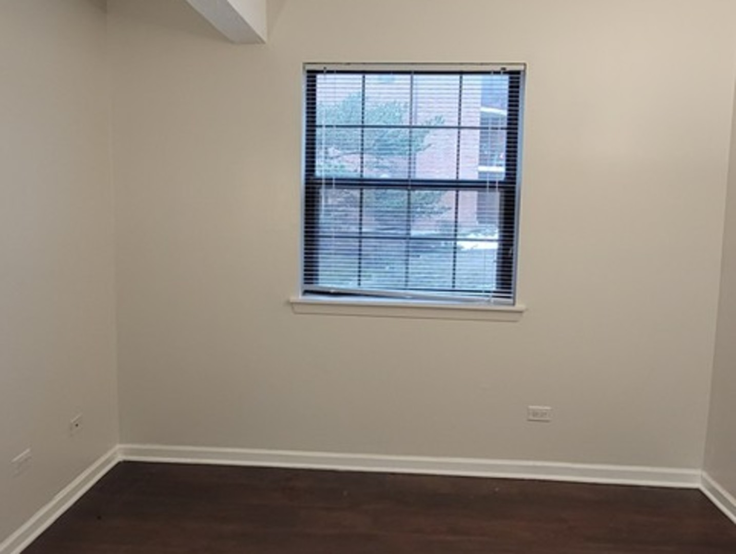 760 Weidner Road, Unit 107 Buffalo Grove, IL 60089 - Photo 10 of 22 an empty room with a window