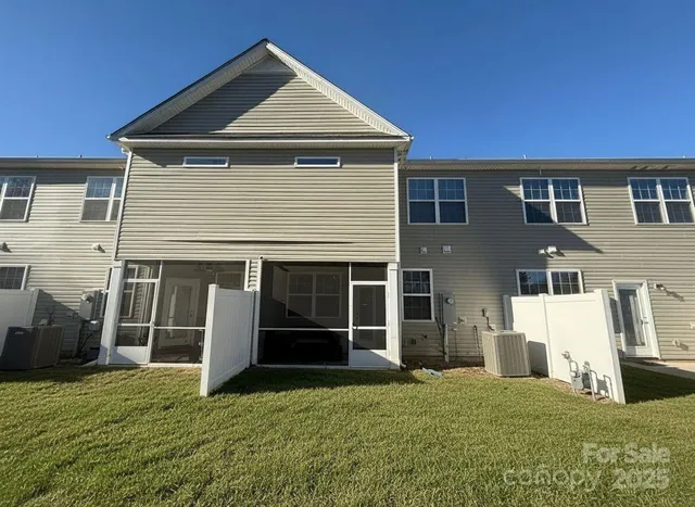 a view of a lake with couches chairs under an umbrella