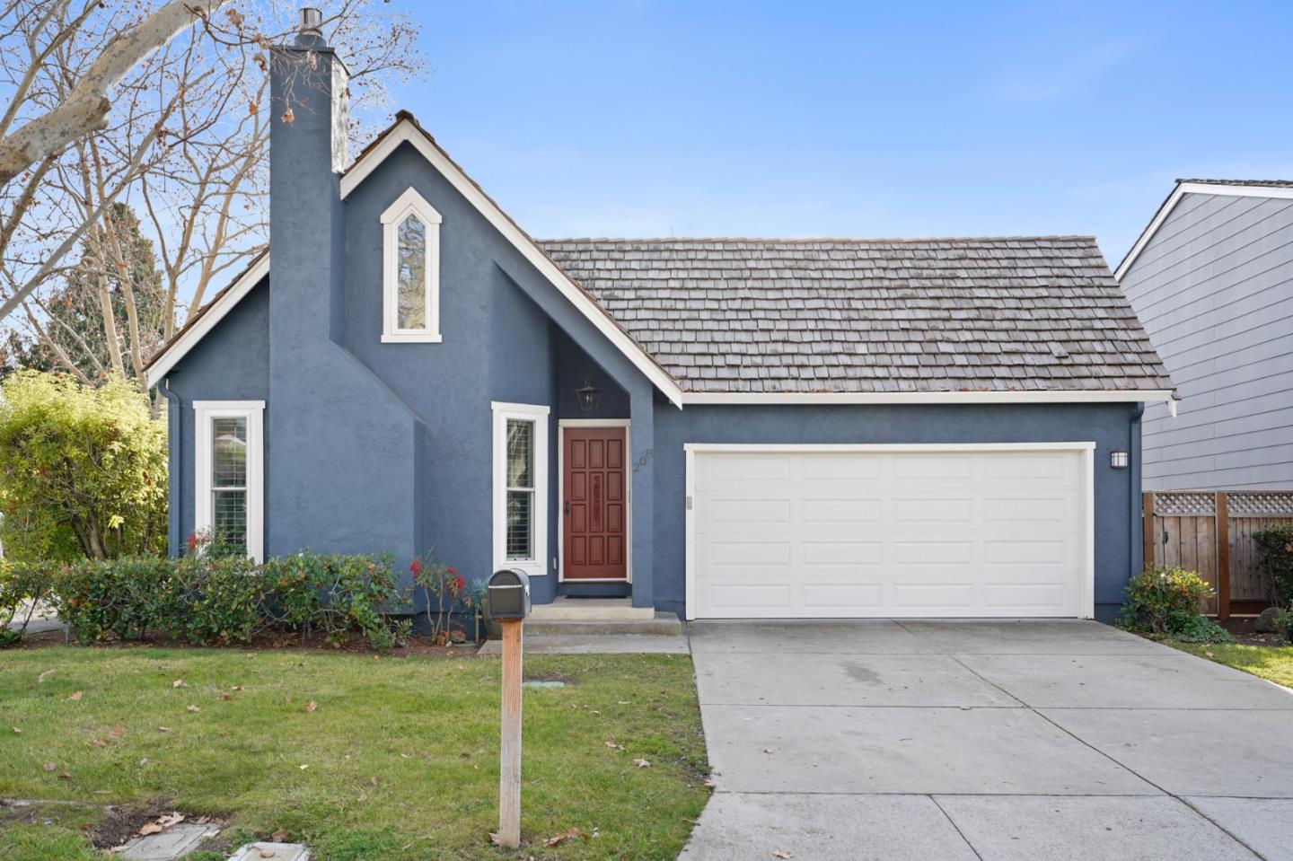 Bentley Square Mountain View, CA 94040 - Photo 1 of 17 a front view of a house with a garden and garage