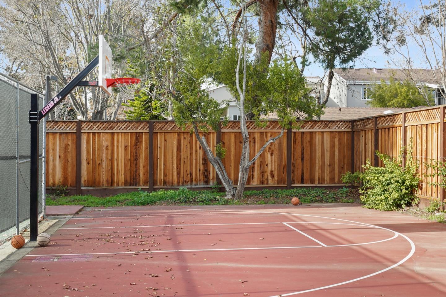 208 Bentley Square Mountain View, CA 94040 - Photo 16 of 17 a white house with a flower garden in front of it