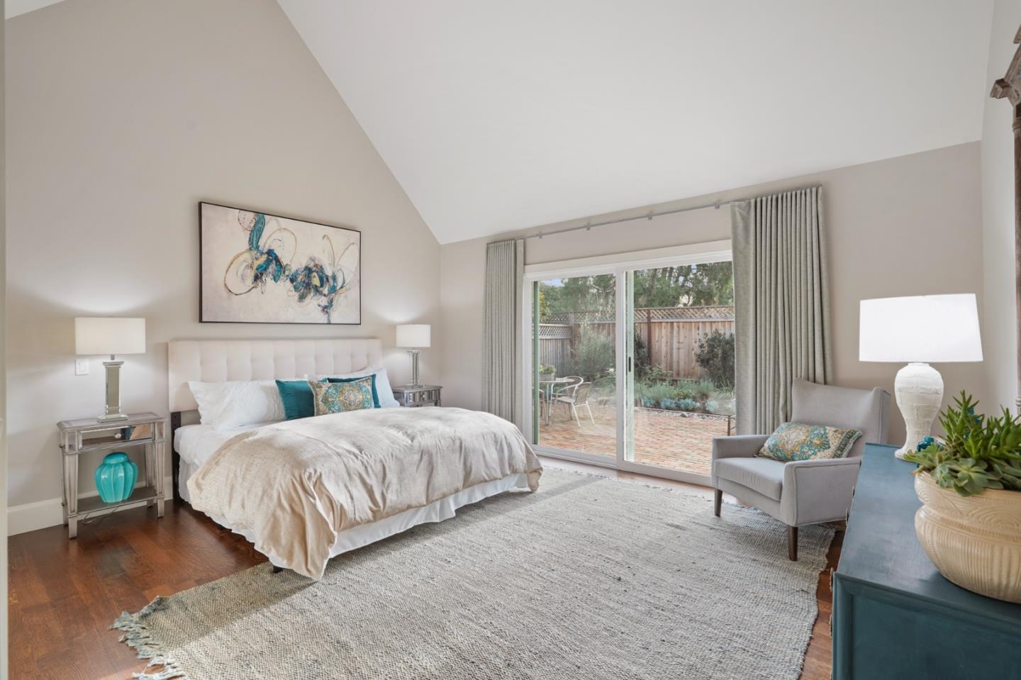 208 Bentley Square Mountain View, CA 94040 - Photo 7 of 17 a bedroom with a large bed and a couch