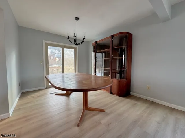 a view of a room with furniture window and wooden floor