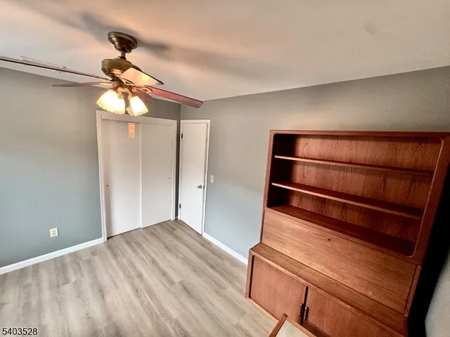 a view of room with window and cabinet